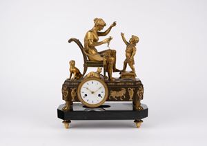 A gilt bronze and black marble mantel clock, early 19th c.