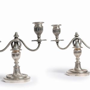 A couple of silver candelabra, 20th Century, defects