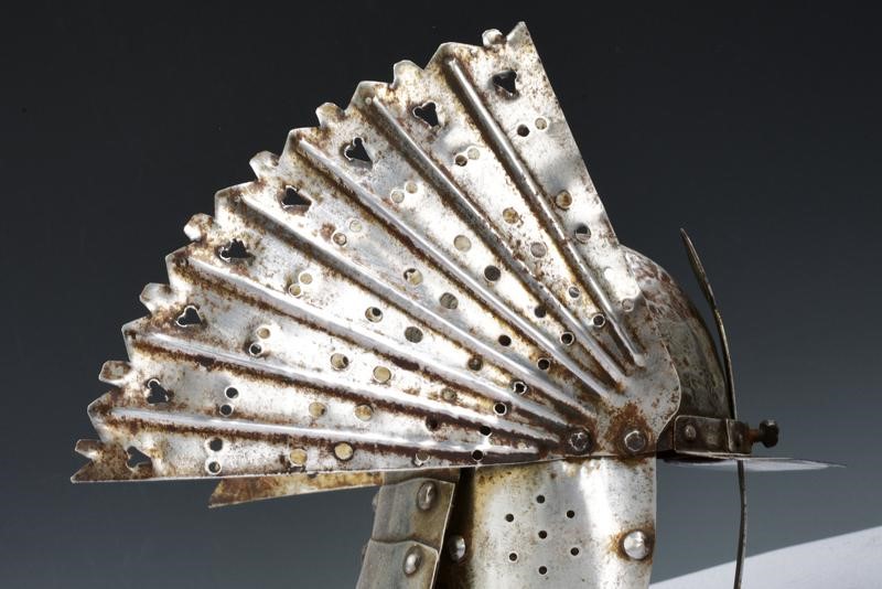 Miniatura di un taschetto alato a coda di gambero, ferro, 1900 circa