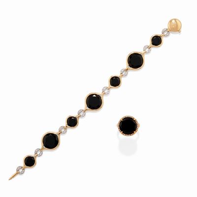Demi parure in oro bicolore 18k con onice e diamanti