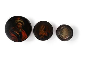 Two horn snuffboxes representing religious subjects and one in papier-machè representing a portrait of a Turk, 19th century