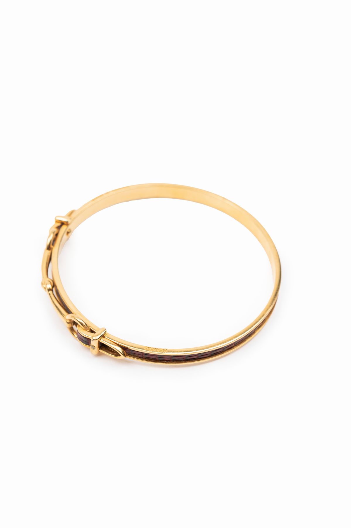 Hermès - Bracciale in metallo dorato con inserto in pelle, anni '80