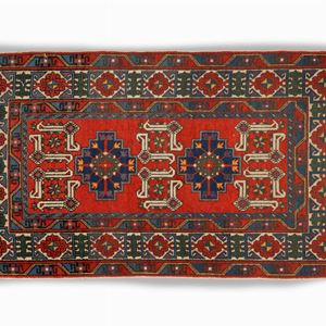 Tappeto Bukhara a fondo rosso con motivi geometrici, Tuchia, secolo XX