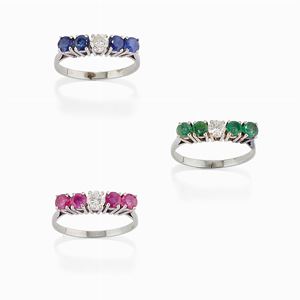 Three 18K white gold, diamond, emerald, ruby and sapphire rings