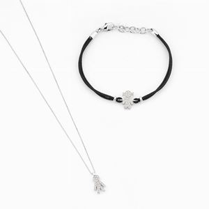 A 18K white gold and diamond bracelet (signed Crivelli) and a pendant