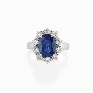 A 18K white gold, sapphire and diamond ring