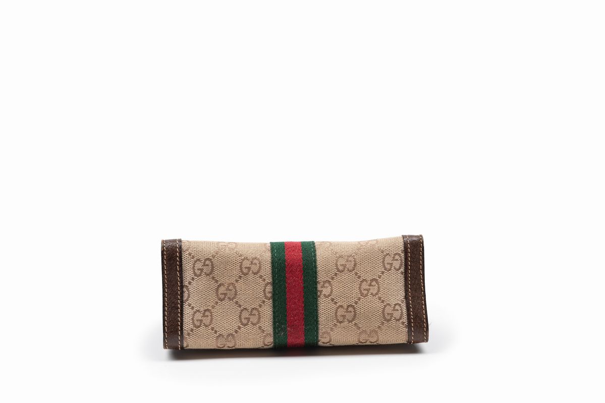 Gucci - Trousse in tela logata GG con profili in pelle di cinghiale e banda web