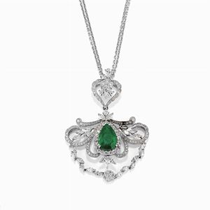 A 18K white gold, diamond and emerald necklace