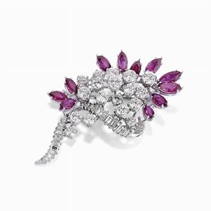 A 18K white gold, diamond and ruby brooch, circa 1970