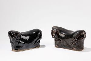 A pair of black ground stonwear pillow. China, 20th c.