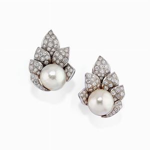 A 18K white gold, cultured pearl and diamond earclips