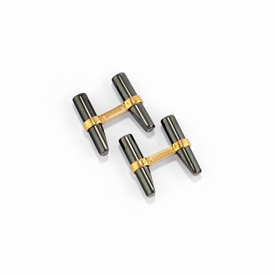Coppia di polsini in oro giallo 18k con motivi in ematite