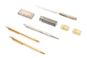 Three silver pens, two lighters and a letter opener