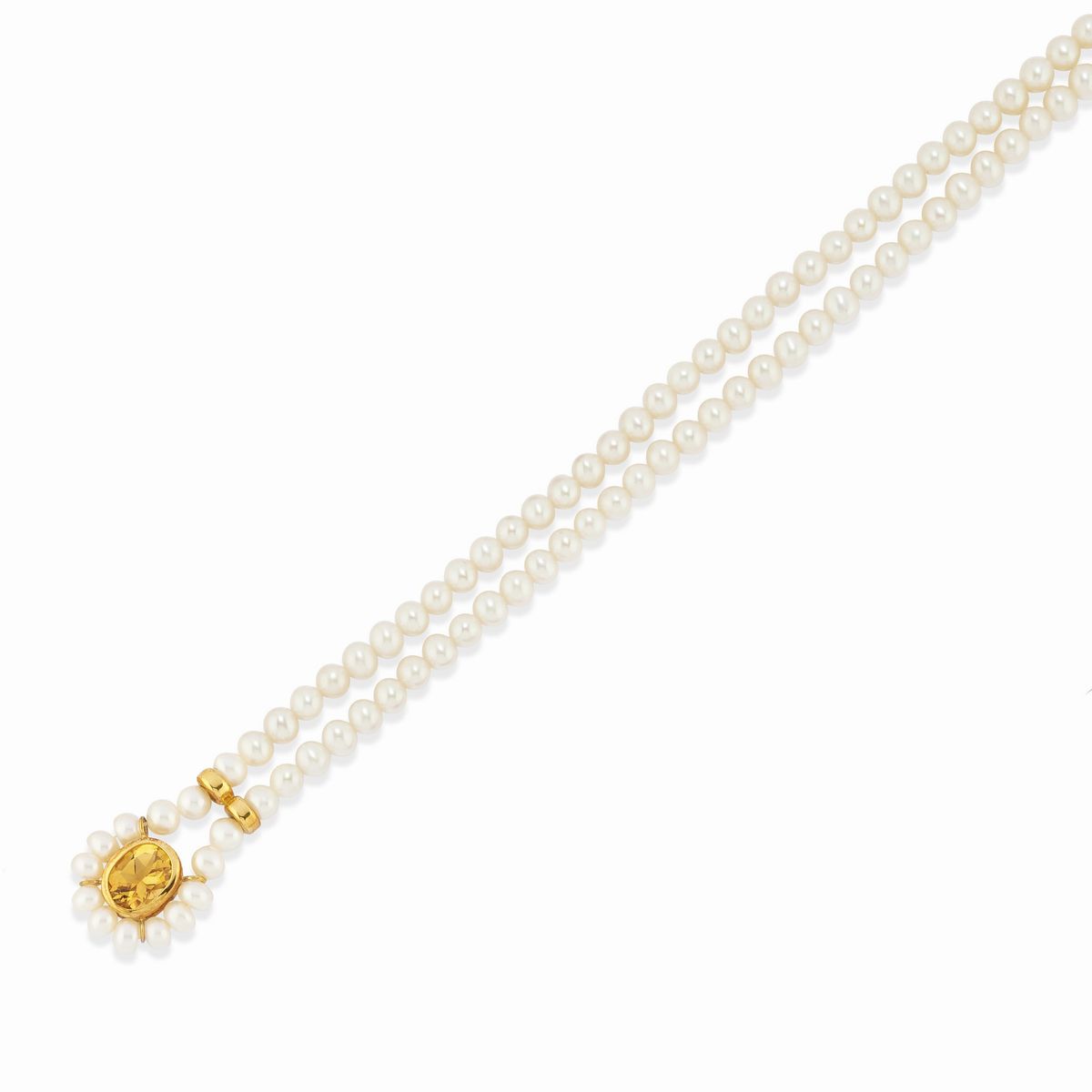 Due collane e un bracciale in oro giallo 18k con perle coltivate
