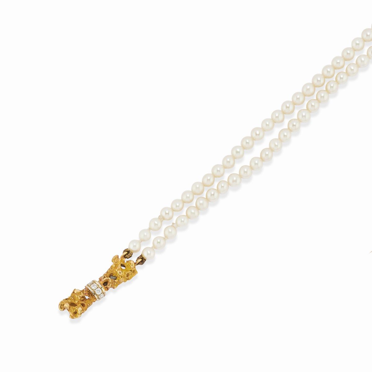 Due collane e un bracciale in oro giallo 18k con perle coltivate
