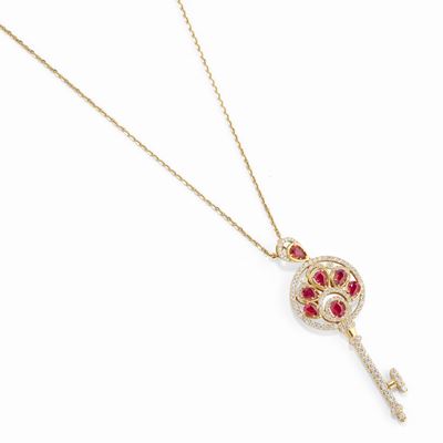 Pendente a forma di chiave in oro giallo 18k con rubini e diamanti
