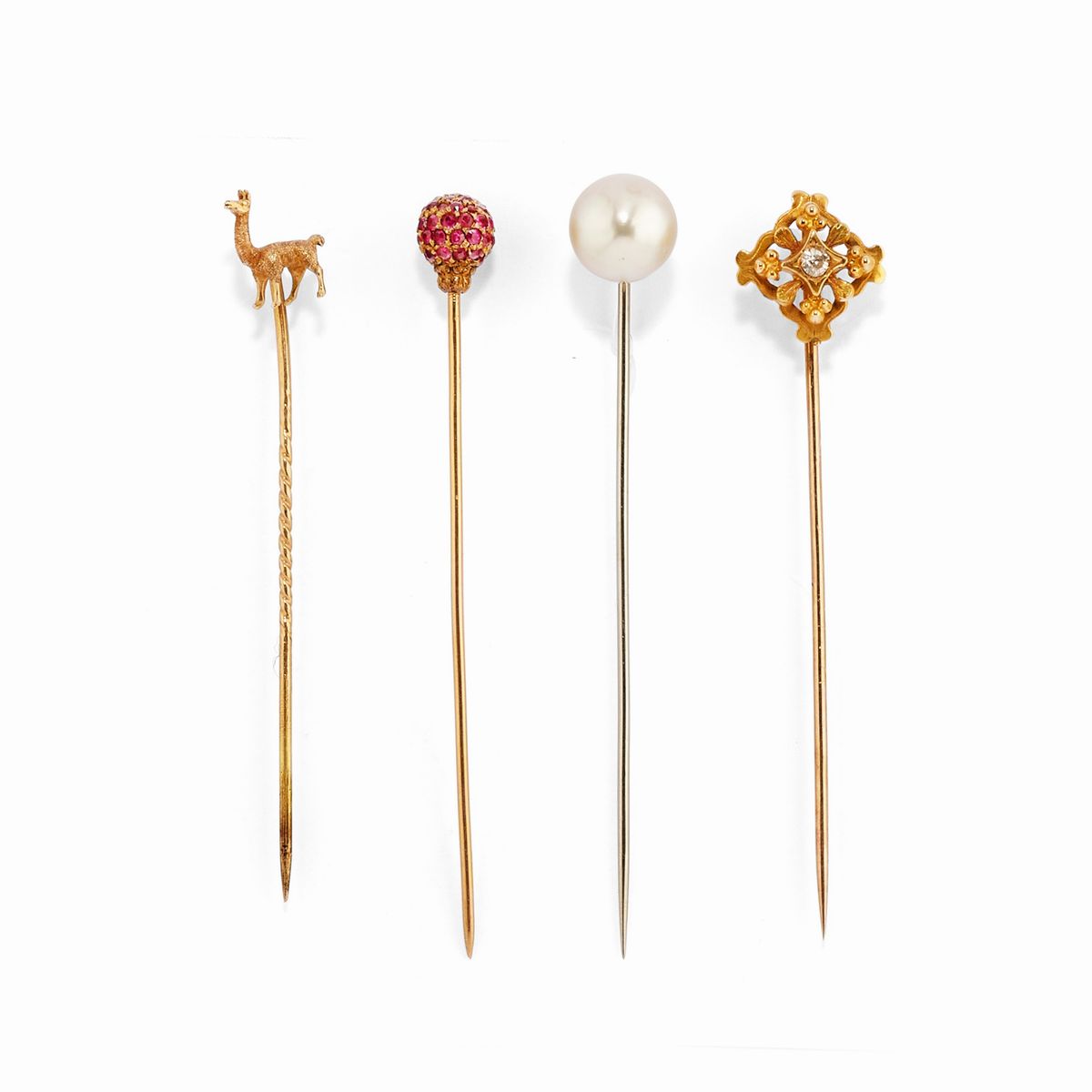 Set di quattro spilloni e coppia di polsini in oro giallo 18k e argento con smeraldi