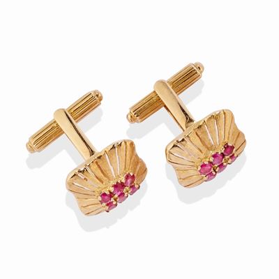 Coppia di polsini in oro rosso 18k con rubini