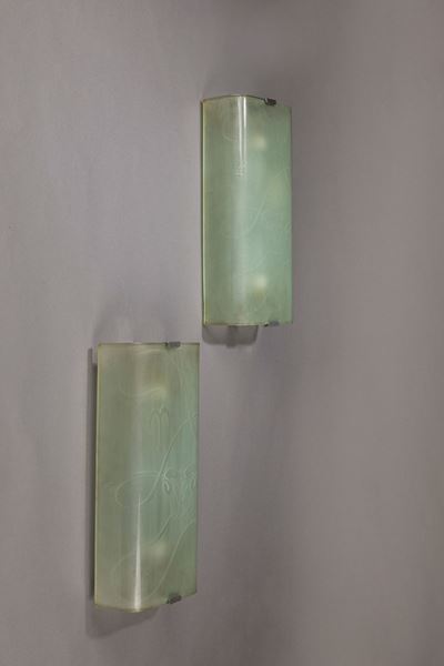 Coppia di appliques in vetro curvato con simboli dell'oroscopo