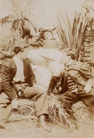 Two dressed men and a woman