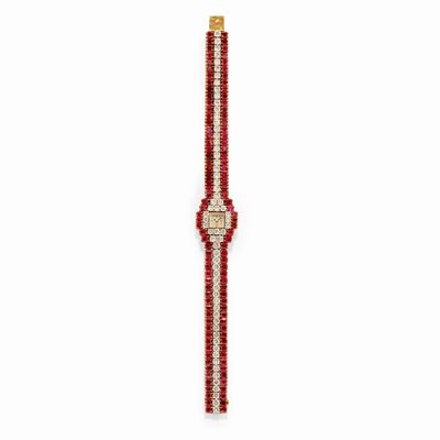 Orologio in oro bicolore 18k con diamanti e rubini
