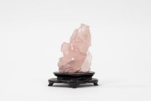  - Rose quartz snuff bottle depicting a child on a fish, China, 20th century