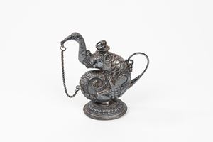 Small oriental silver jug in the shape of a fantastic animal, late 19th century
