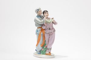 A FAMILLE ROSE PORCELAIN FIGURE