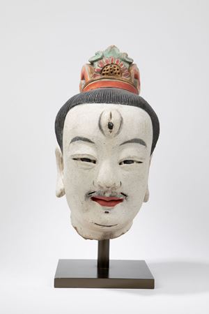 A MALE STUCCO HEAD