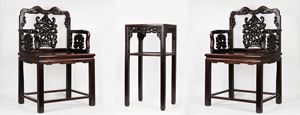  - Pair of armchairs and a carved wooden table in oriental style, 20th century
