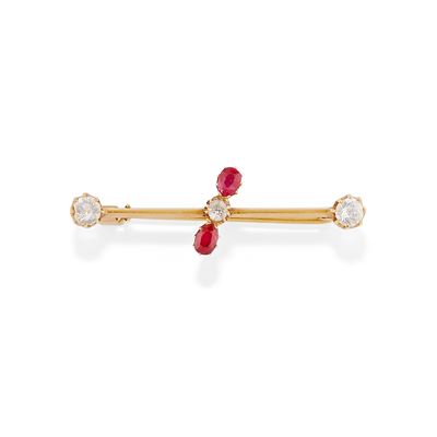 Spilla in oro giallo 18k con rubini e pietre incolori