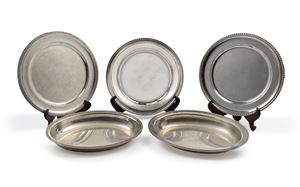 Three silver plates and two trays