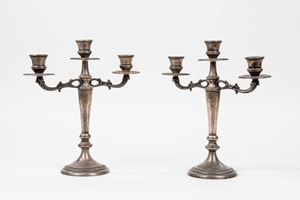  - Pair of three-light silver candlesticks