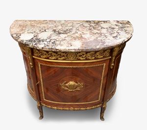 Important demi-lune sideboard in inlaid bois de rose wood, with elegant gilt bronze finishes, 19th century