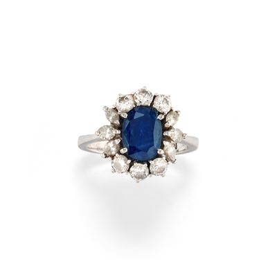 Anello con zaffiro ovale di ct 1,00 e diamanti in oro bianco 18k