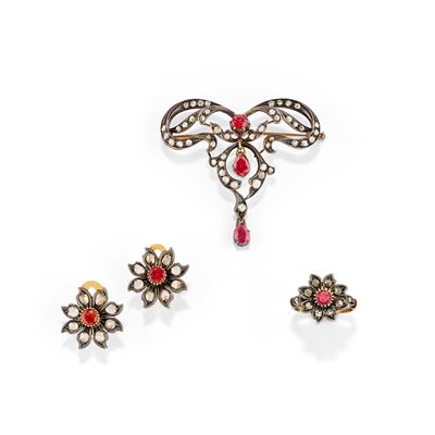 Demi parure in oro giallo e argento con rubini e diamanti