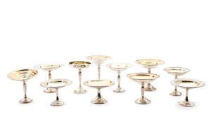 Eleven silver and vermeil stands