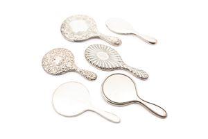 Six silver toilette mirrors