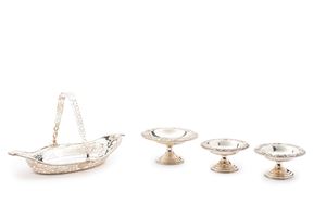 Three silver stands and a basket