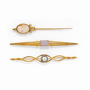 Three 18K yellow gold, silver, diamond, gemstone and cameo brooches