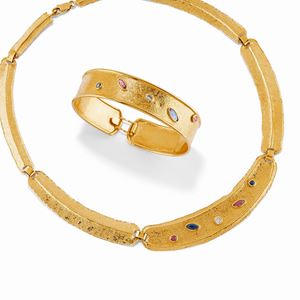 A 18K yellow gold, ruby, sapphire and synthetic diamond demi parure