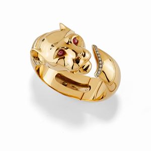 A 18K two-color gold, ruby and diamond bracelet, signed Cartier Paris, numbered