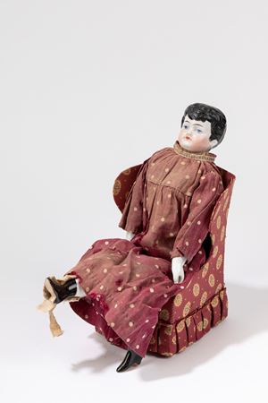 Bambola con poltrona