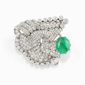 A platinum, diamond and emerald brooch