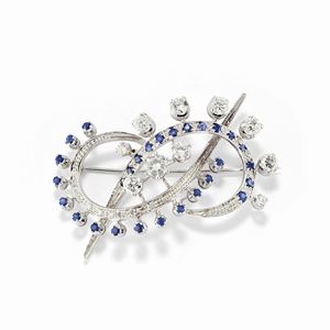 A 18K white gold, sapphire and diamond brooch