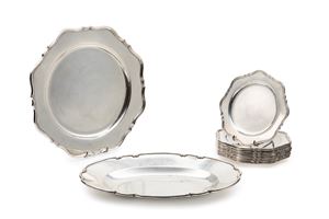 Twelve saucers, a plate and a tray