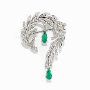 A 18K white gold, emerald and diamond brooch