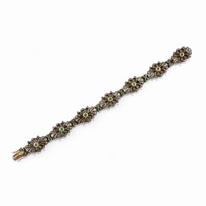 A silver, low-carat gold, emerald and diamond bracelet