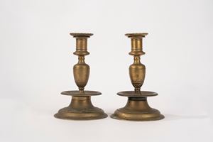  - Pair of bronze spool candlesticks, 17th century