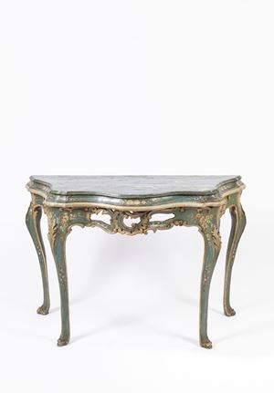 Carved and lacquered wood console table with a blue background